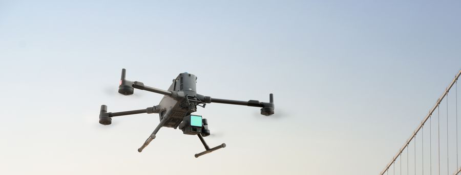 Survey drone over a suspension bridge